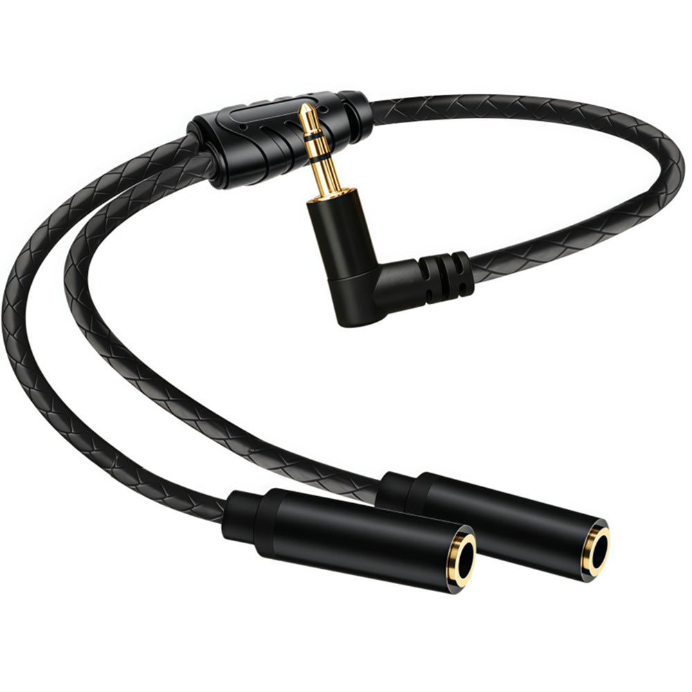 Black braided Y audio cable laid out to show one 90-degree male plug branching into two straight female sockets