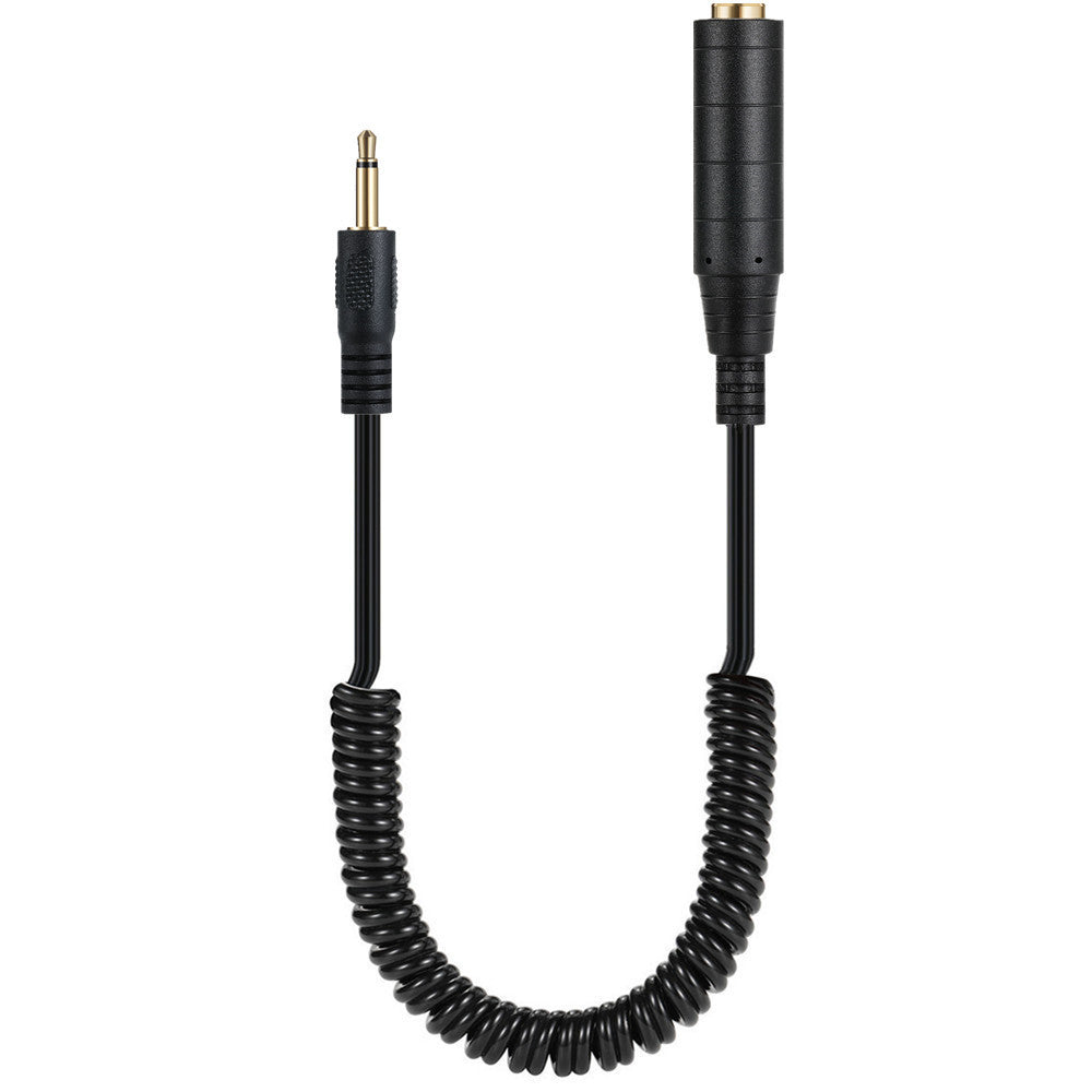 A black coiled extension cable with a 3.5mm mono male single channel jack on one end and a 6.35mm female jack on the other.