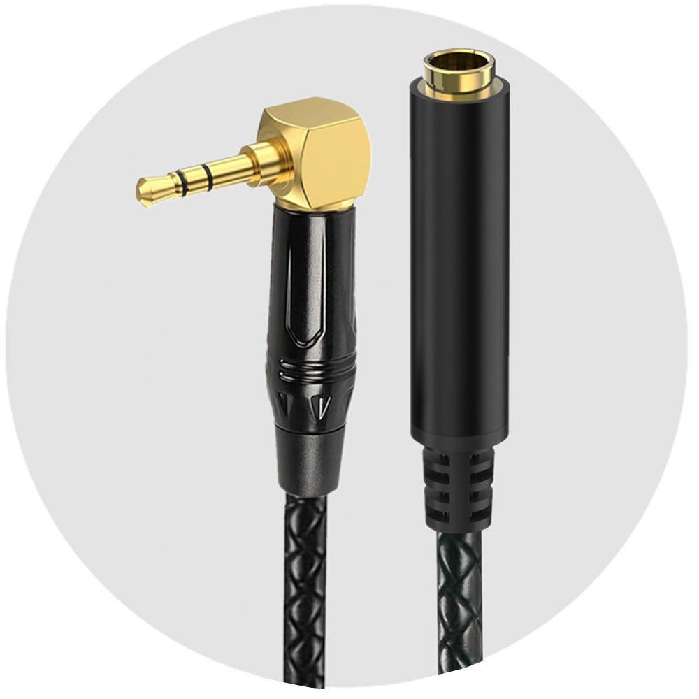 Audio cable with gold and black connectors on a white background