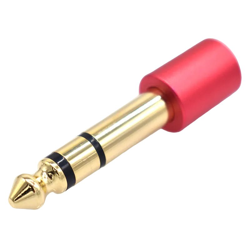 Gold and red audio plug on a white background