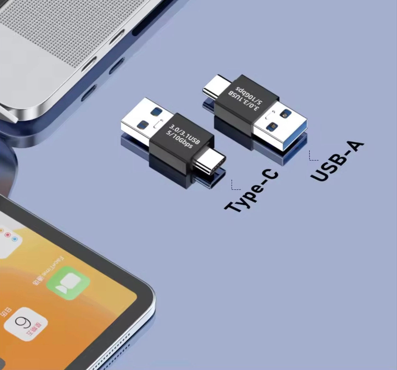 Two USB Type-C to USB-A adapters on a blue surface with a smartphone in the background.