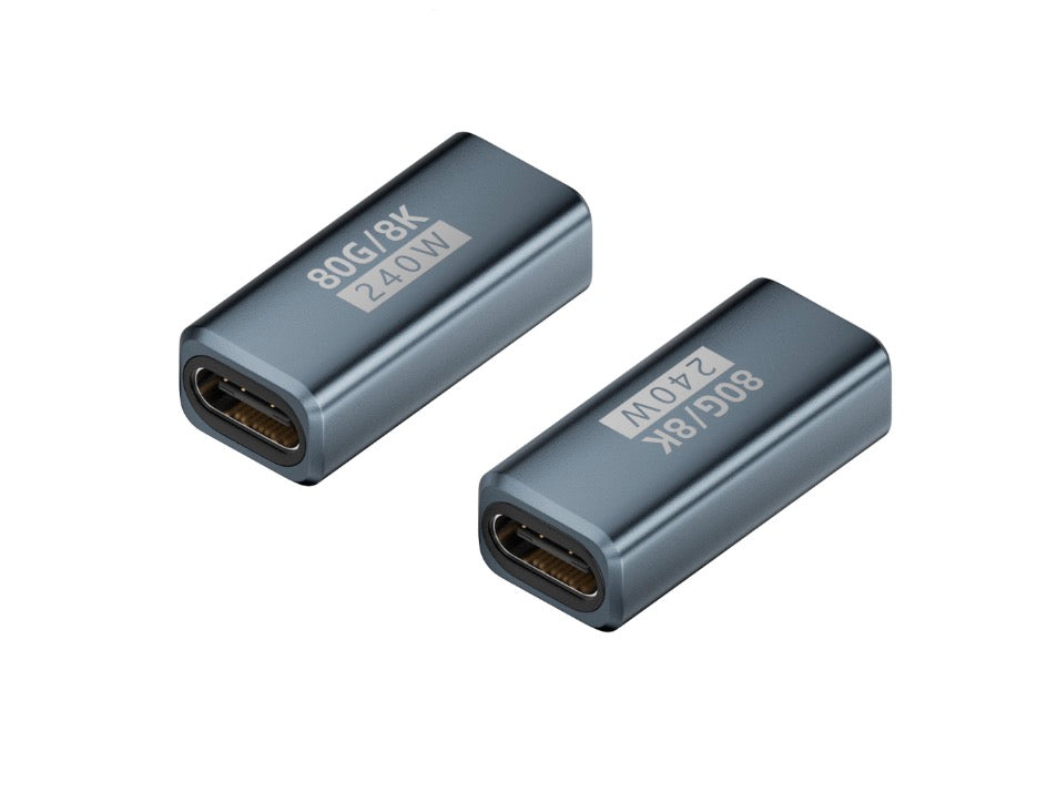 Two USB C extension adapters, one with Type C female to female text, in black color.