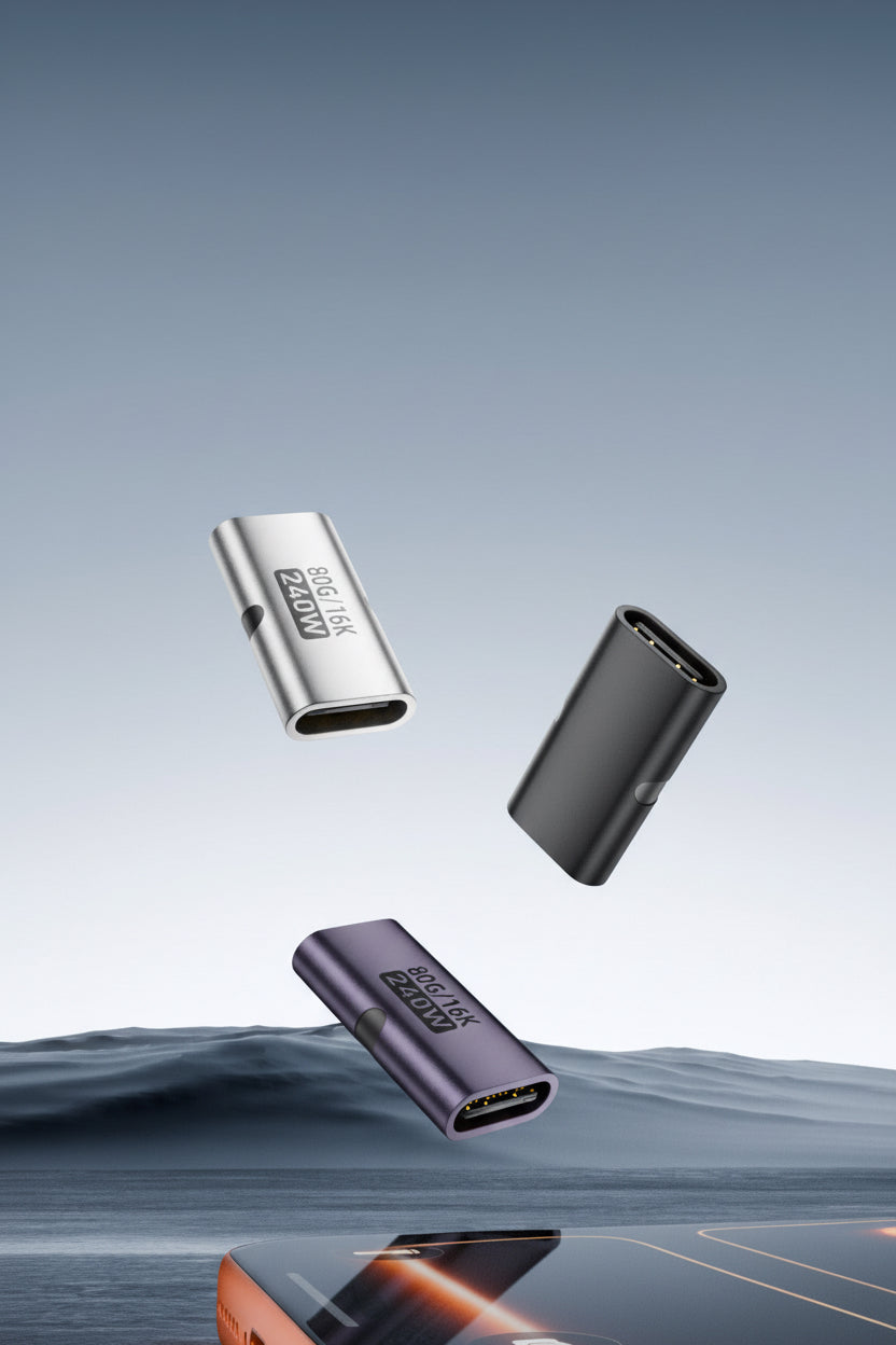 Three USB connectors of different colors on a reflective surface with a gradient background