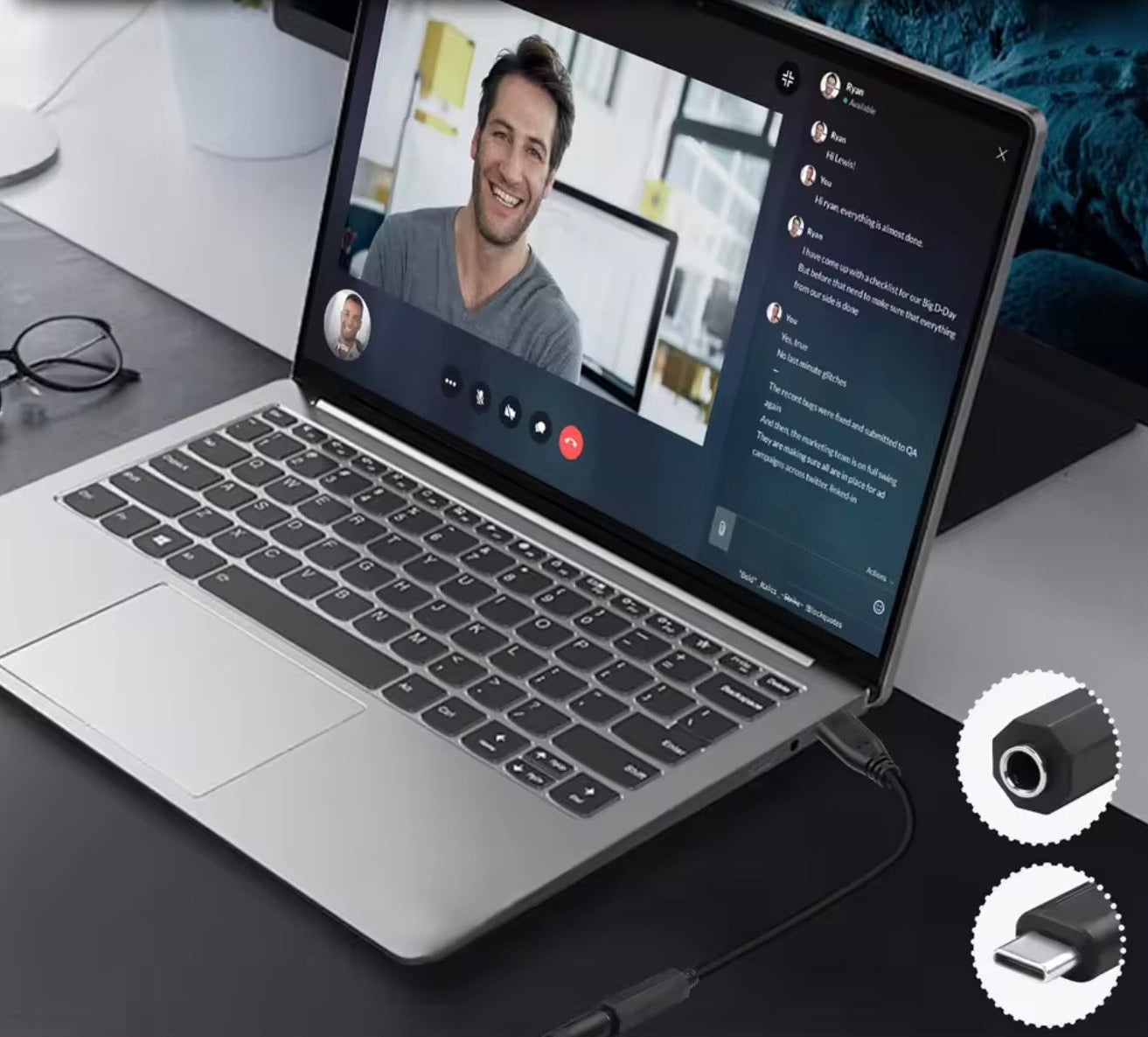 Laptop with webcam and microphone on a desk