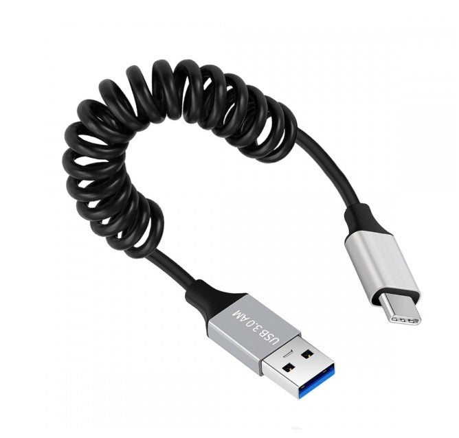 A black coiled USB 3.0 to USB C cable with a USB-A male connector on one end and a USB-C male connector on the other.