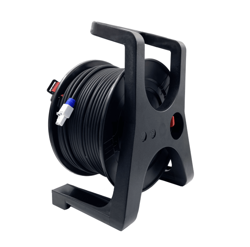 Black cable reel with coiled cable on a white background