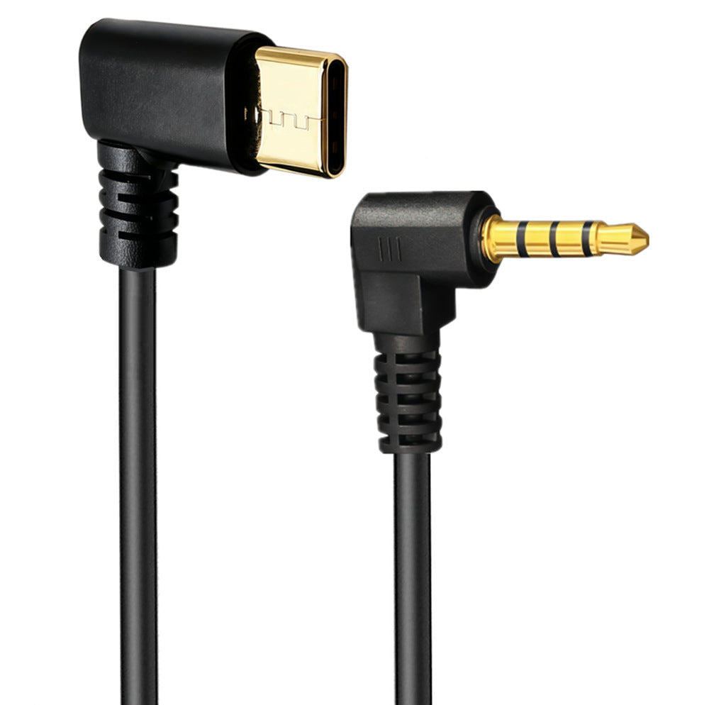 Coiled USB-C male to 3.5mm male audio lead for compatible devices