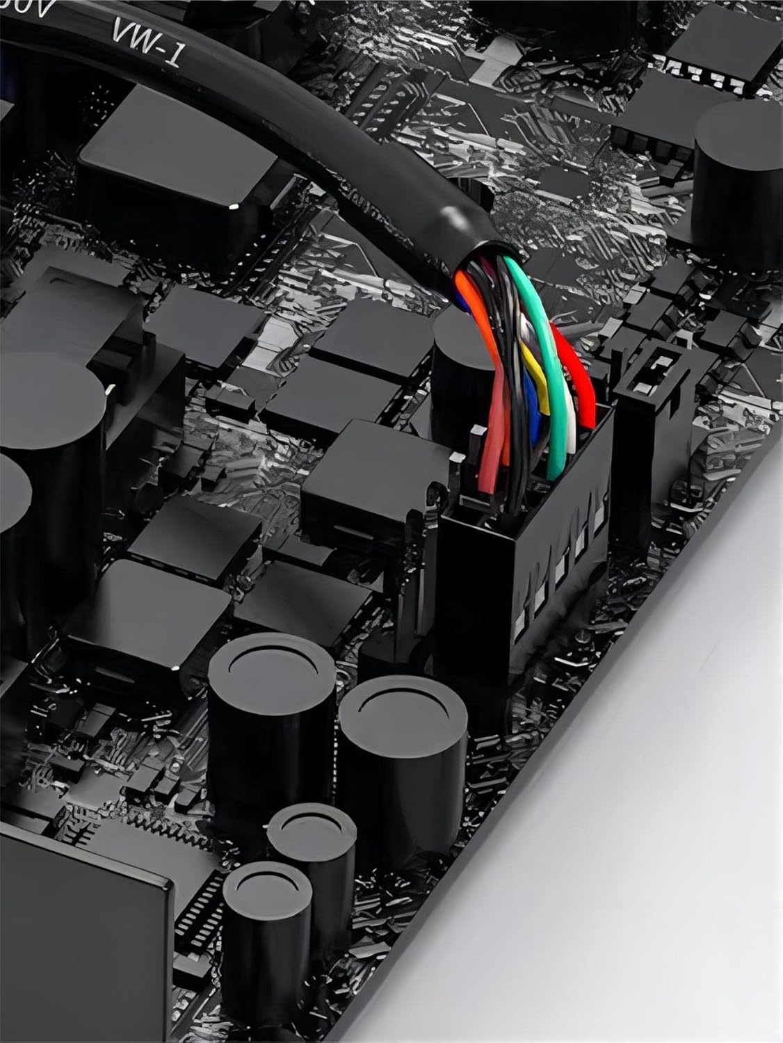 Close-up of a computer motherboard with colorful power cables.