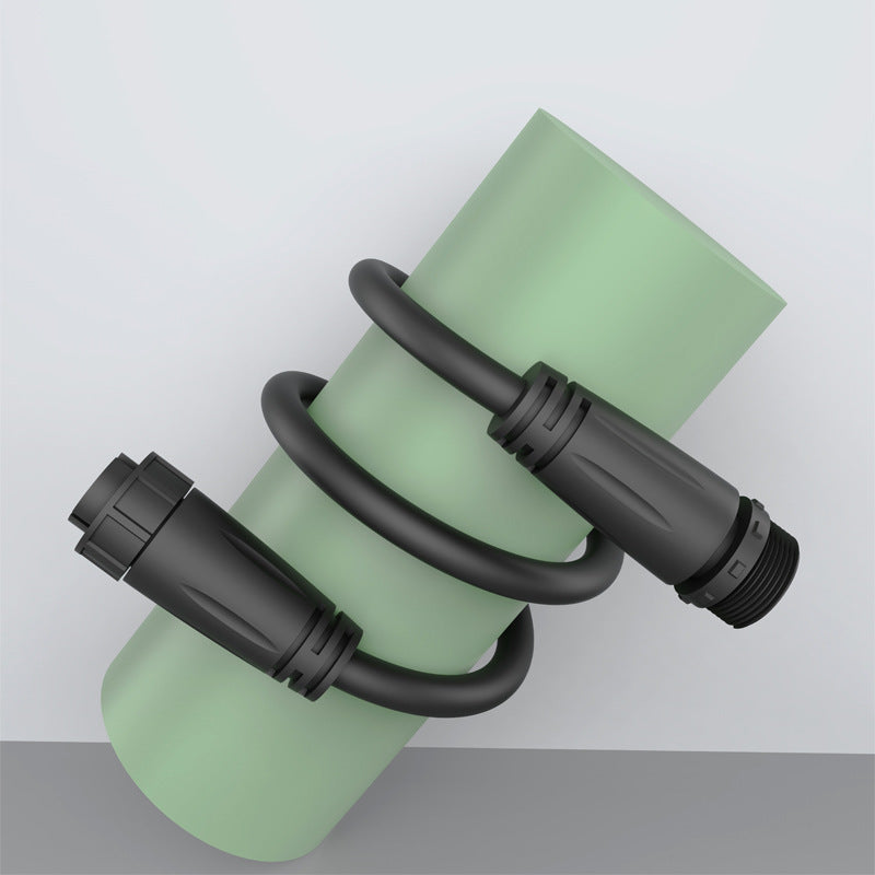 Green water bottle with black connectors on a light gray background