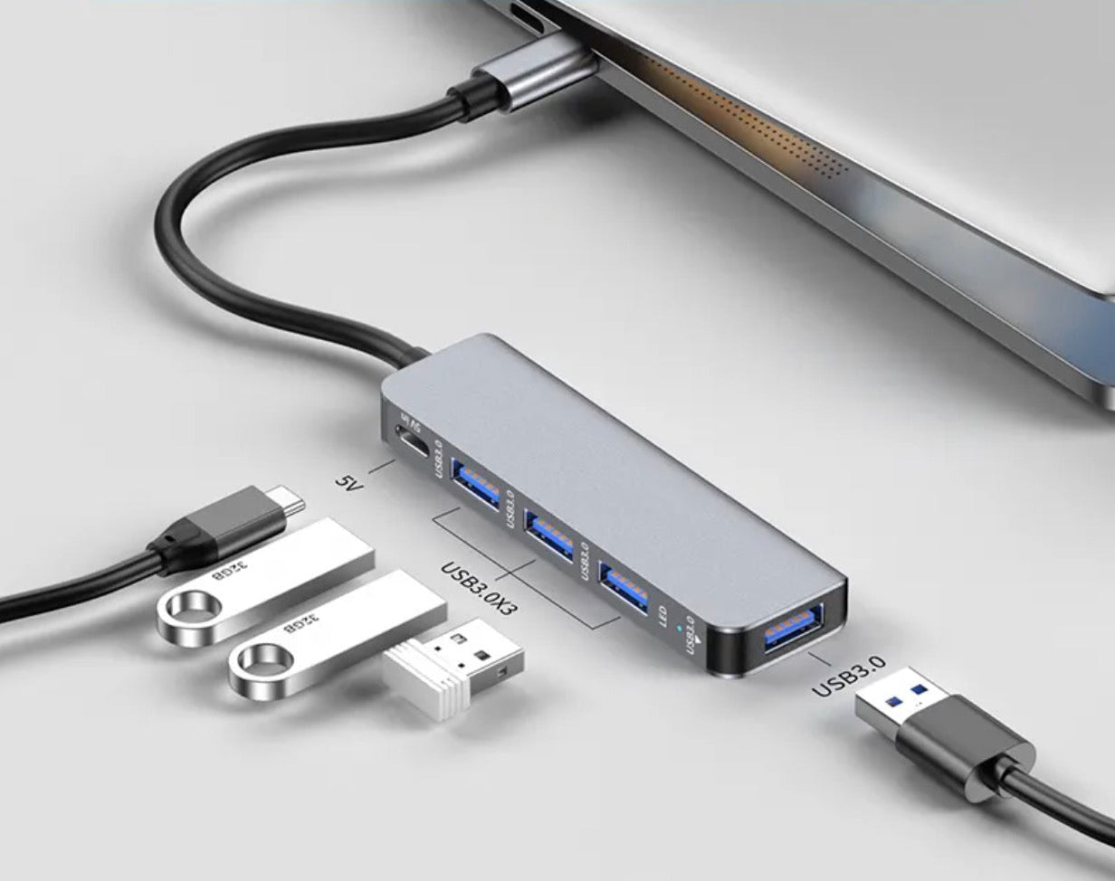 USB-C hub connected to a laptop with multiple USB devices attached