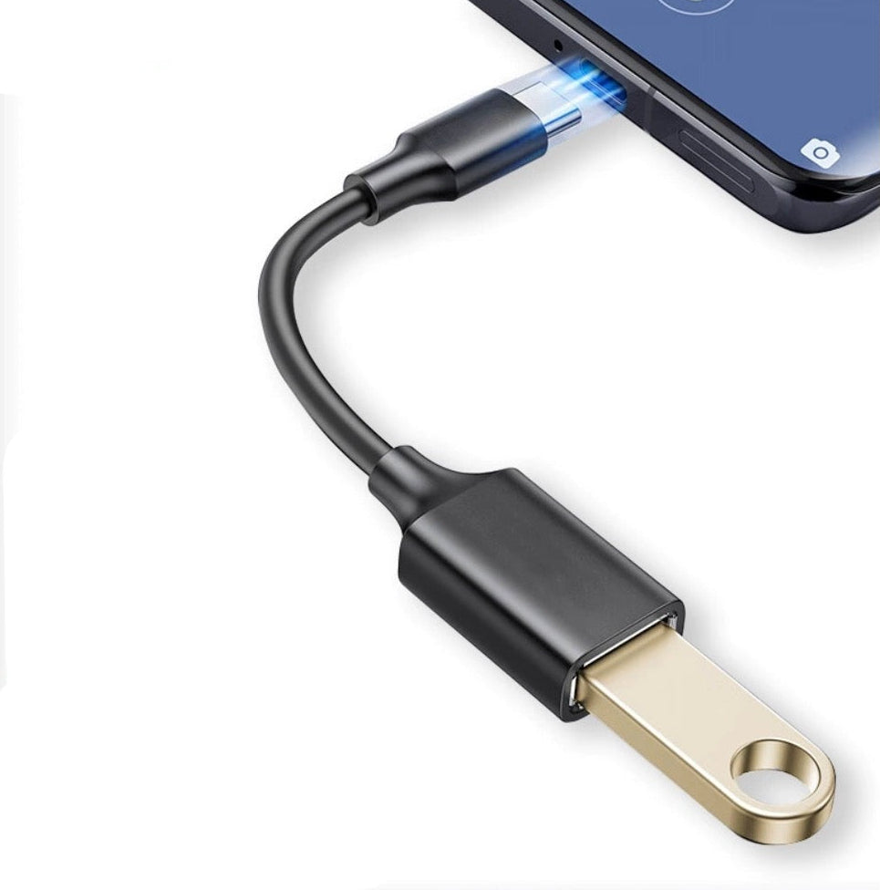 USB-C to USB 3.0 female OTG adapter cable connected to a smartphone for peripheral connectivity