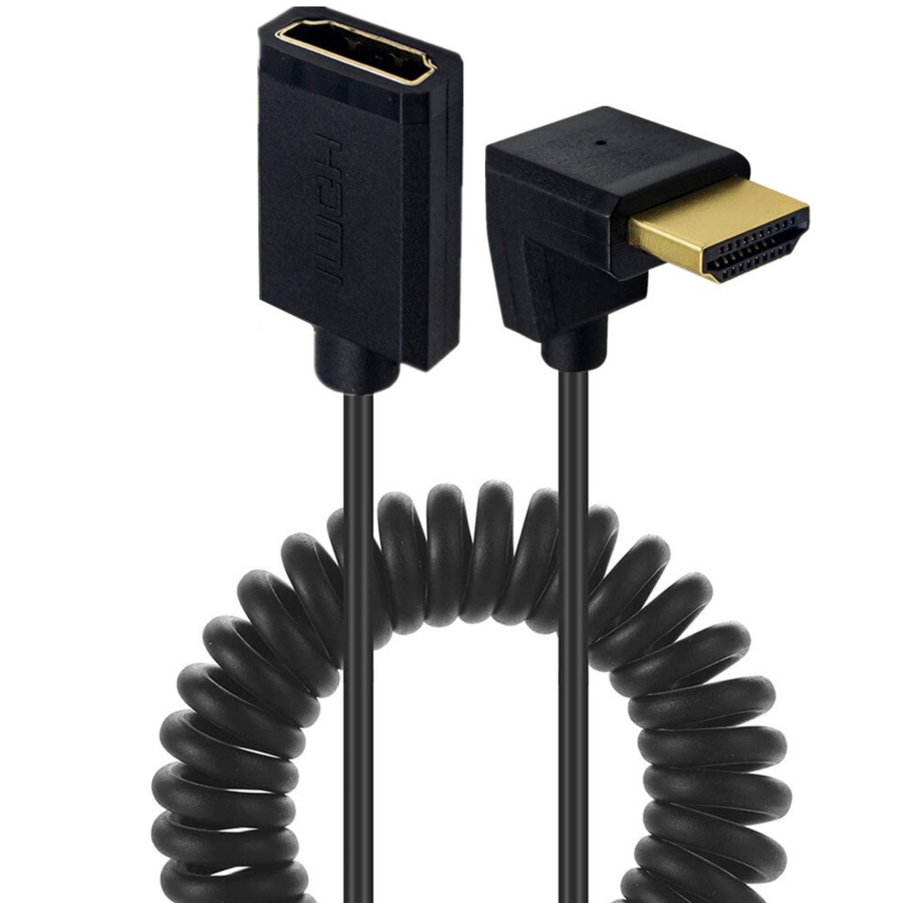 Coiled HDMI cable connected to TV and laptop demonstrating compact routing.
