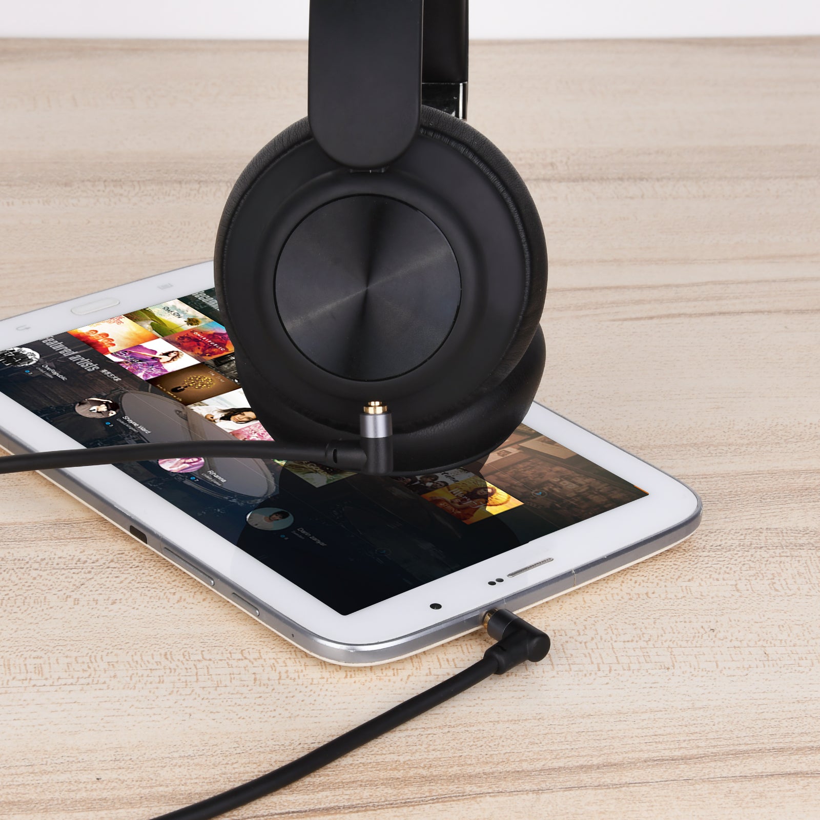 AUX cable connected to smartphone and headphones.