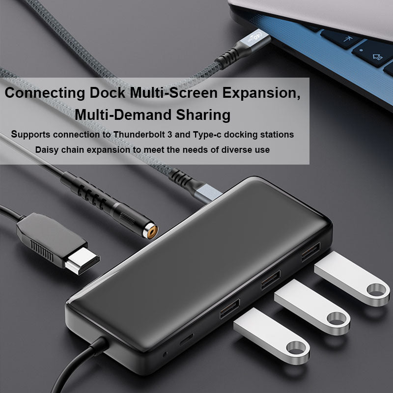 Black docking station with cables on a dark surface