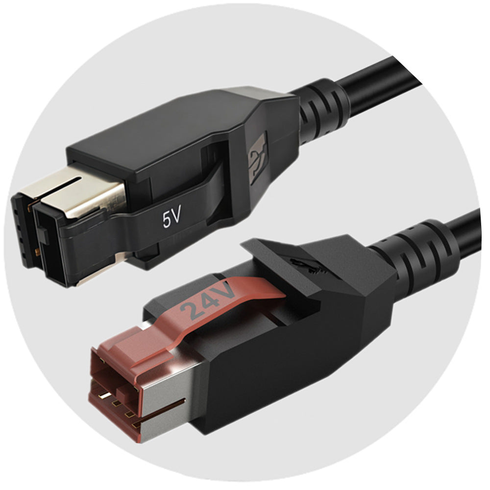Close-up of two USB connectors with voltage markings on a white background