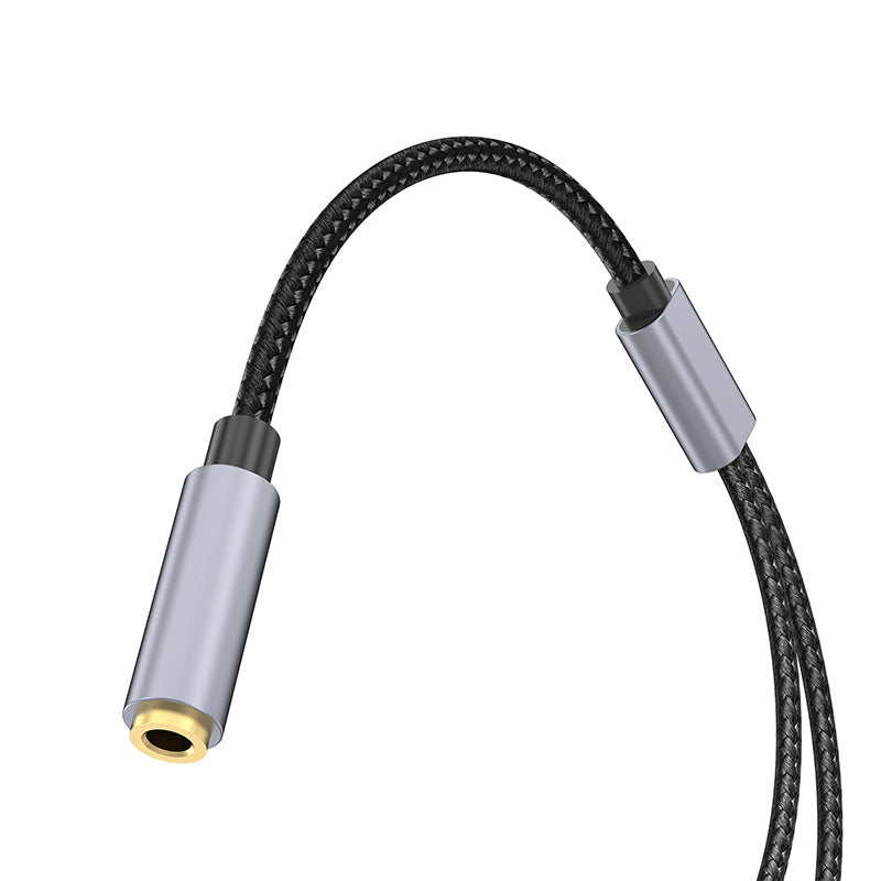 Braided audio cable with metal connector on a white background