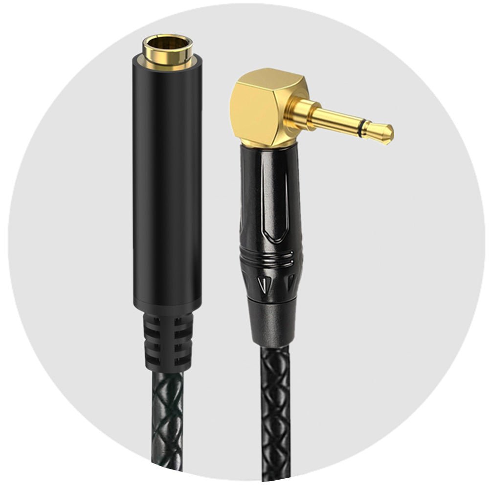 Black audio cable with gold and black connectors on a white background