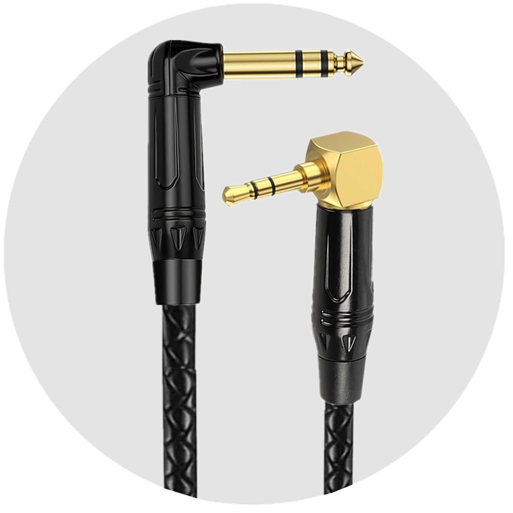 Black and gold audio cable with angled connectors on a white background