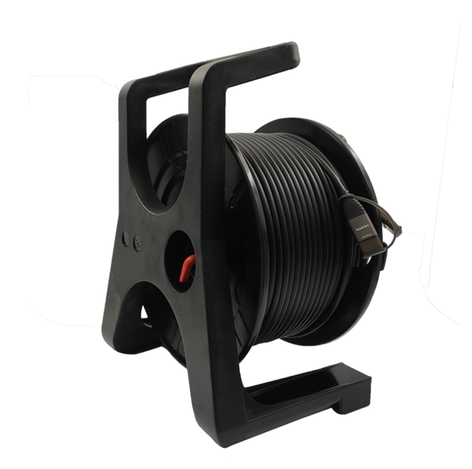 Black cable reel with coiled cable on a white background
