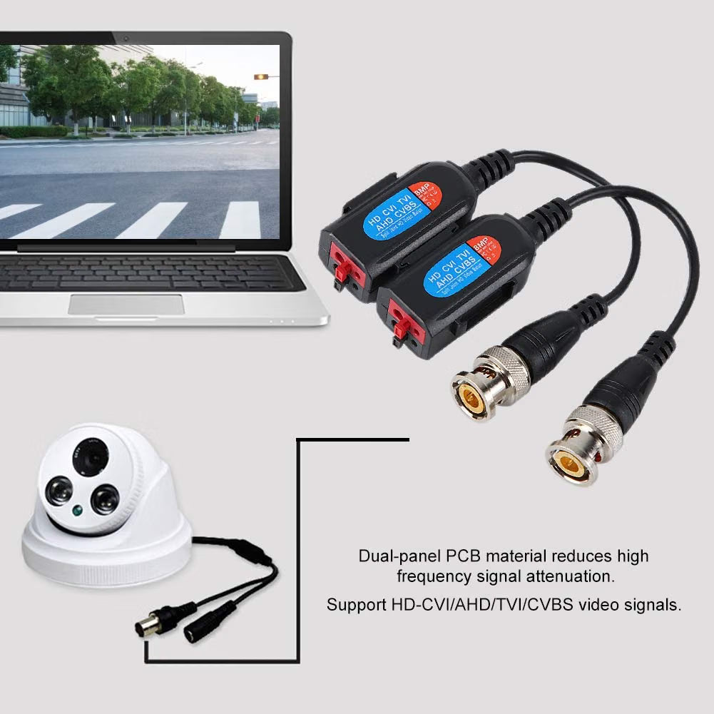 Two black video signal adapters with blue labels and red connector ends, shown beside a laptop displaying a street scene and a white dome security camera on a light gray background. Text on the image describes signal attenuation and support for HD-CVI/AHD/TVI/CVBS video signals.