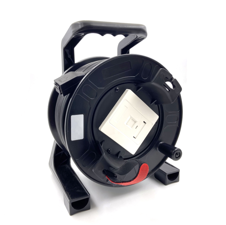 Black cable reel with a white light on a white background