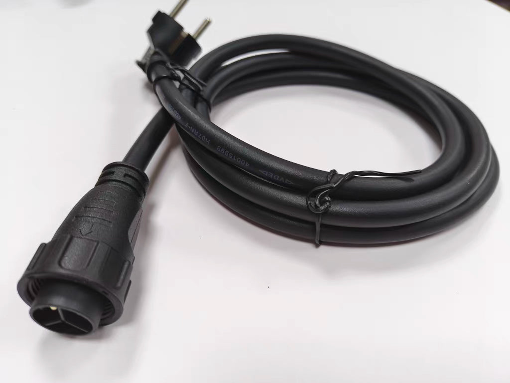 Black electrical cable with plug on a white background