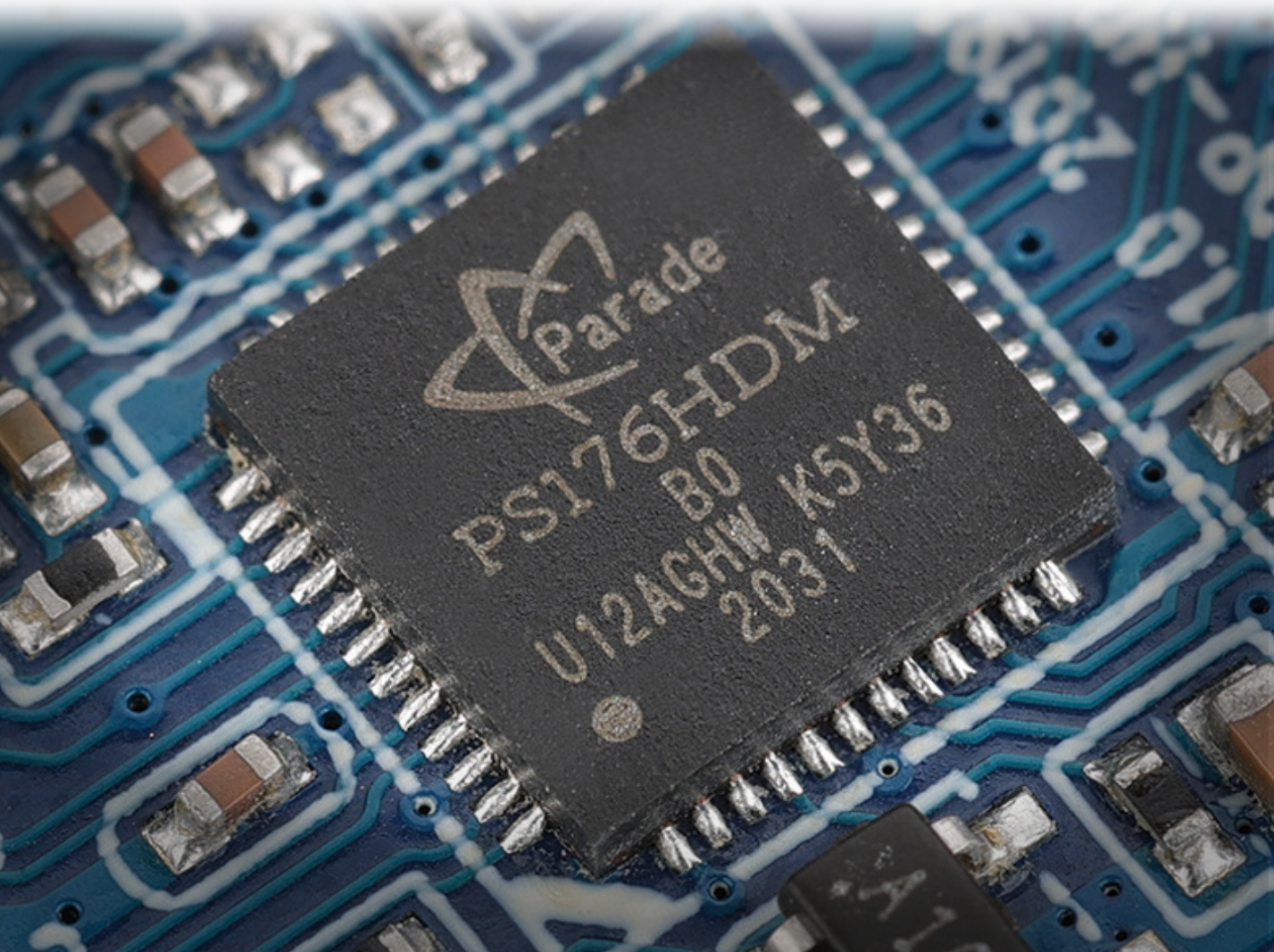 Close-up of a Parade Electronics chip on a circuit board