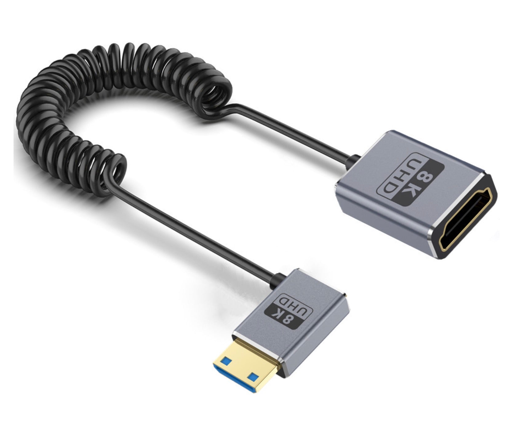 An image showing a coiled extension cable with a Mini HDMI connector on one end and an HDMI connector on the other. The cable is black with a gray silicone coating.