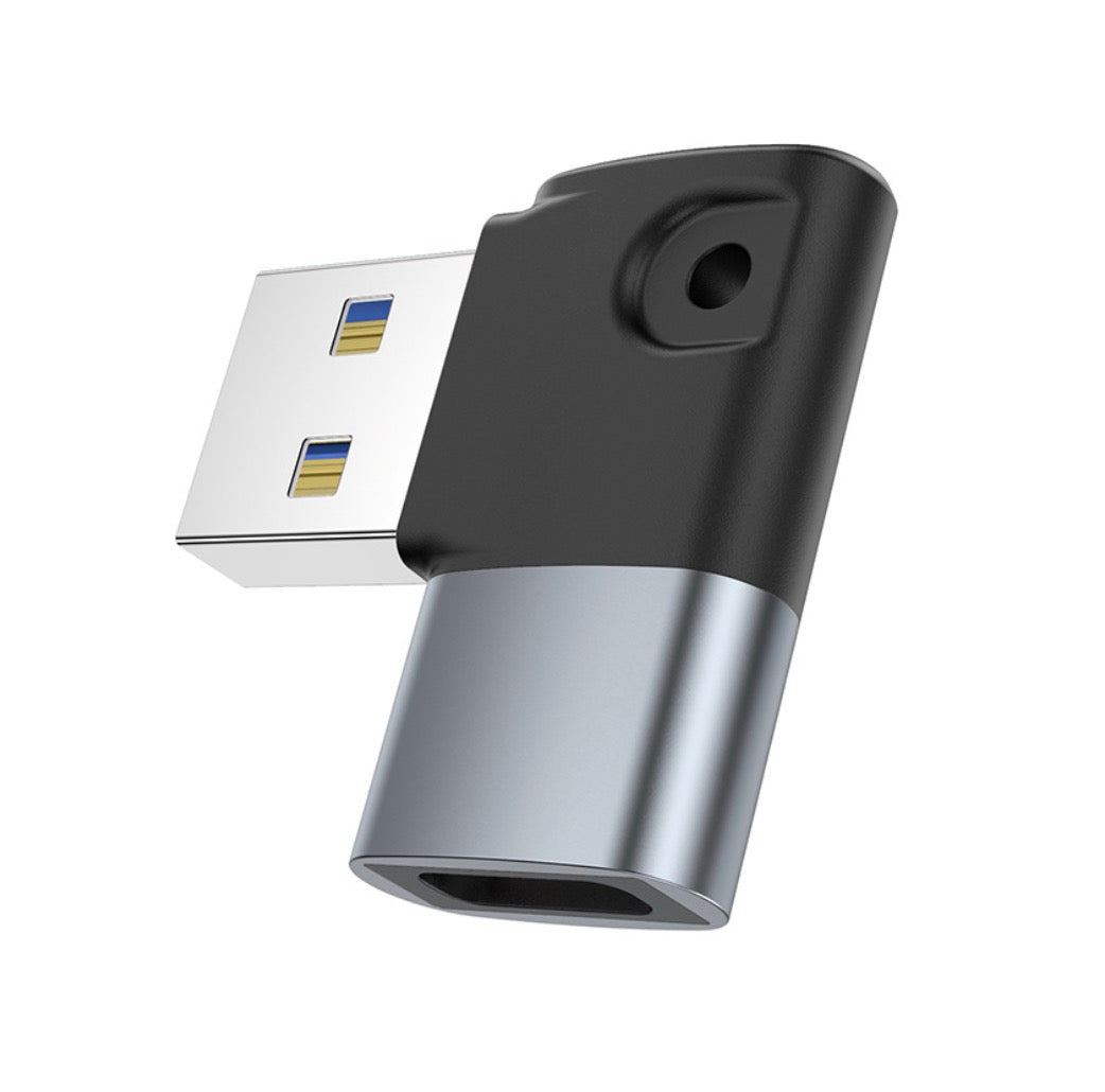 A black USB 3.0 A male to USB C female OTG adapter with a keychain attached.