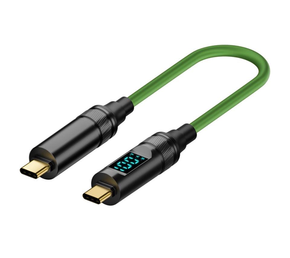 A green USB-C to USB-C cable with a digital display showing the power status, connected to a black USB-C male connector on one end and a Type-C male connector on the other.