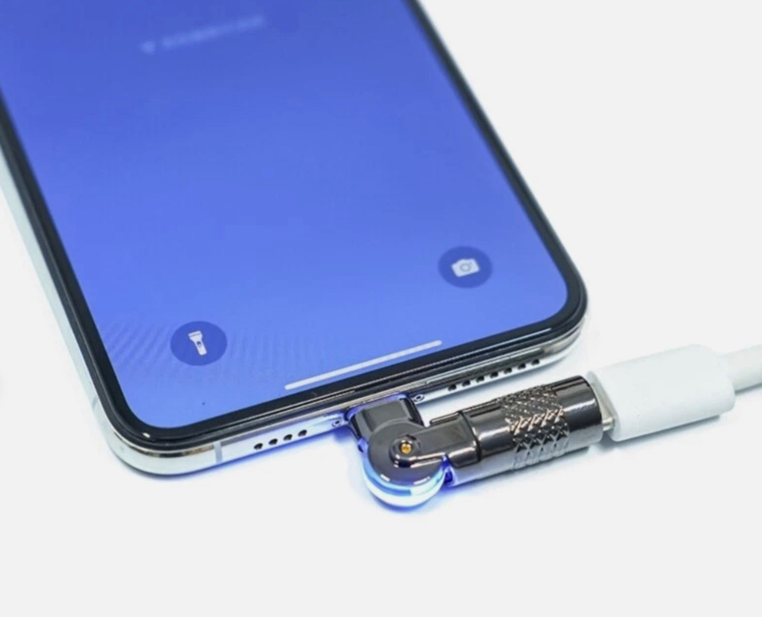 Smartphone with a charging cable connected to its USB-C port on a white background