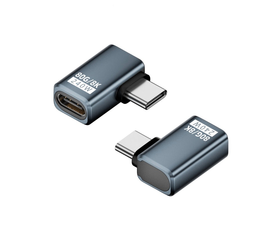 A black USB C angled adapter with a reversible design, featuring a USB 4.0 Male to Female connector.