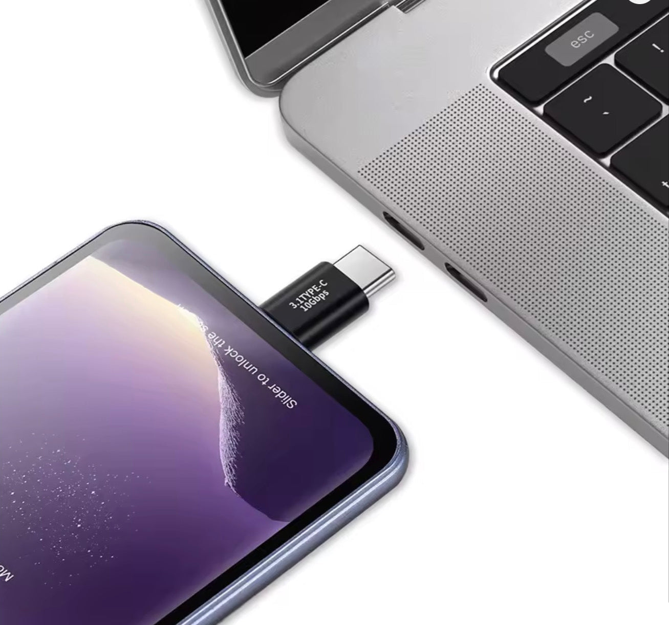 Laptop with USB-C device attached to smartphone on a white background