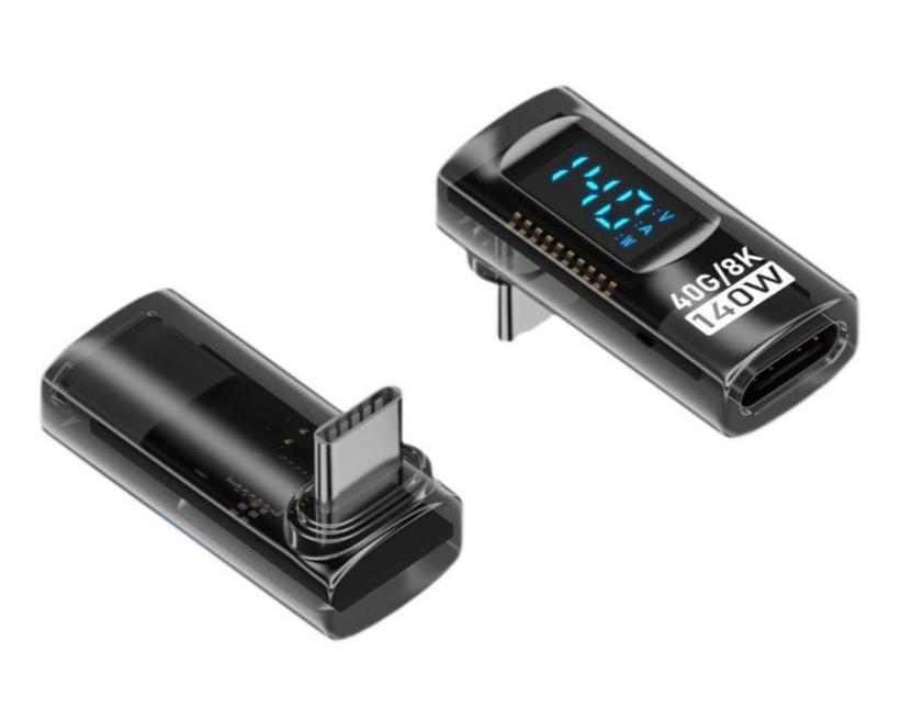 A black USB-C male to female extension adapter with a smart LED display showing voltage, current, and power metrics. It has a transparent design revealing the internal components and a blue LED indicator light.