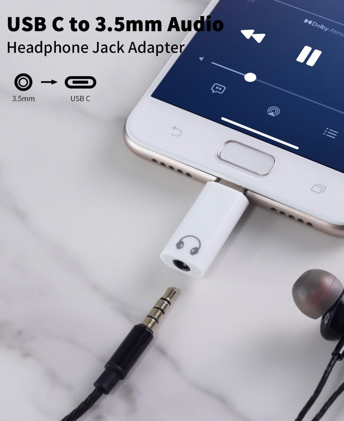 USB C to 3.5mm Audio Headphone Jack Adapter connecting a smartphone to earbuds on a marble surface.