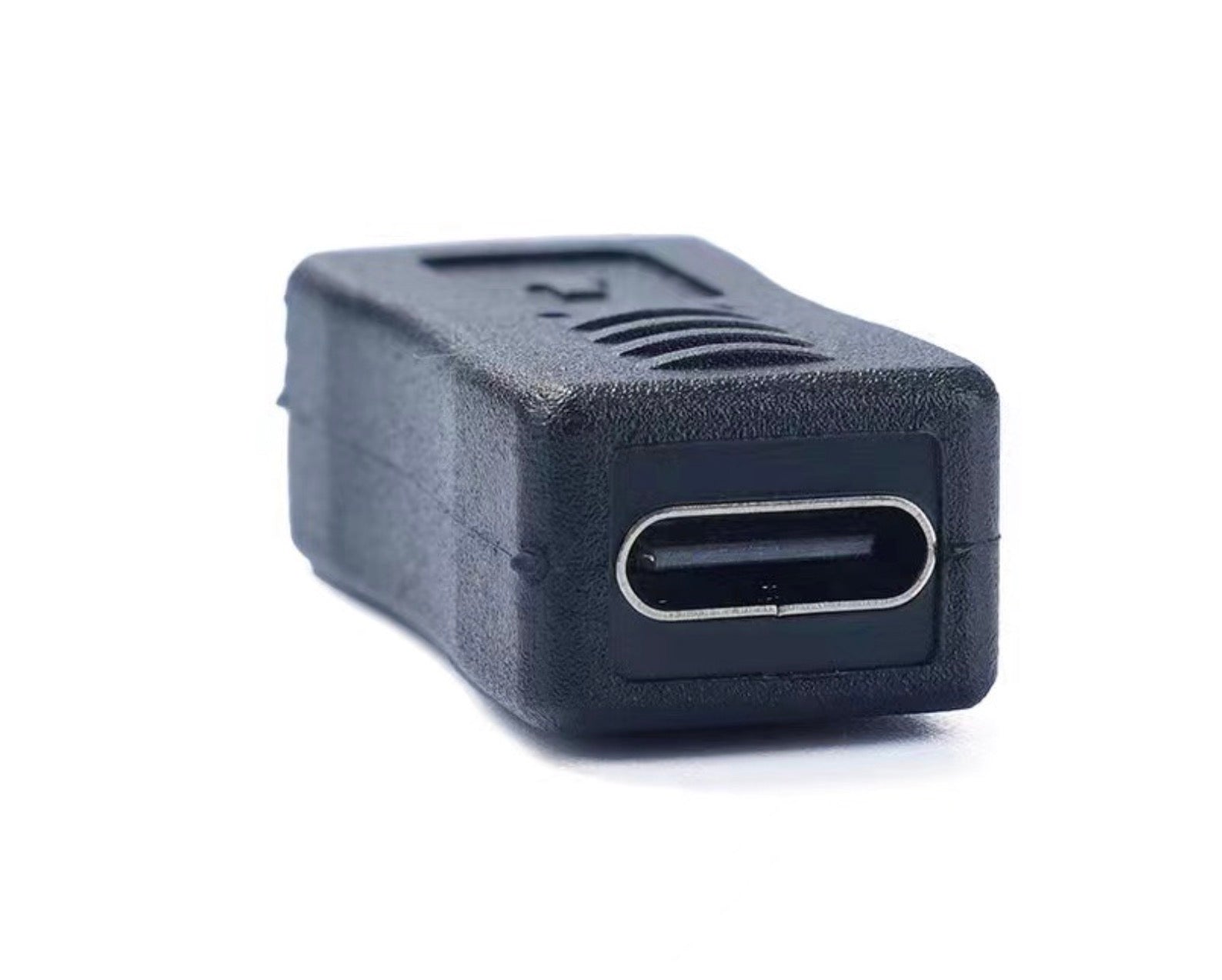 Black USB-C adapter on a white background