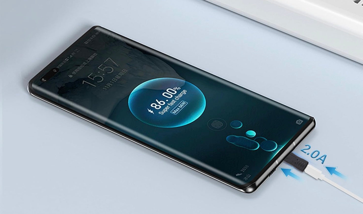 Smartphone with charging cable on a light background