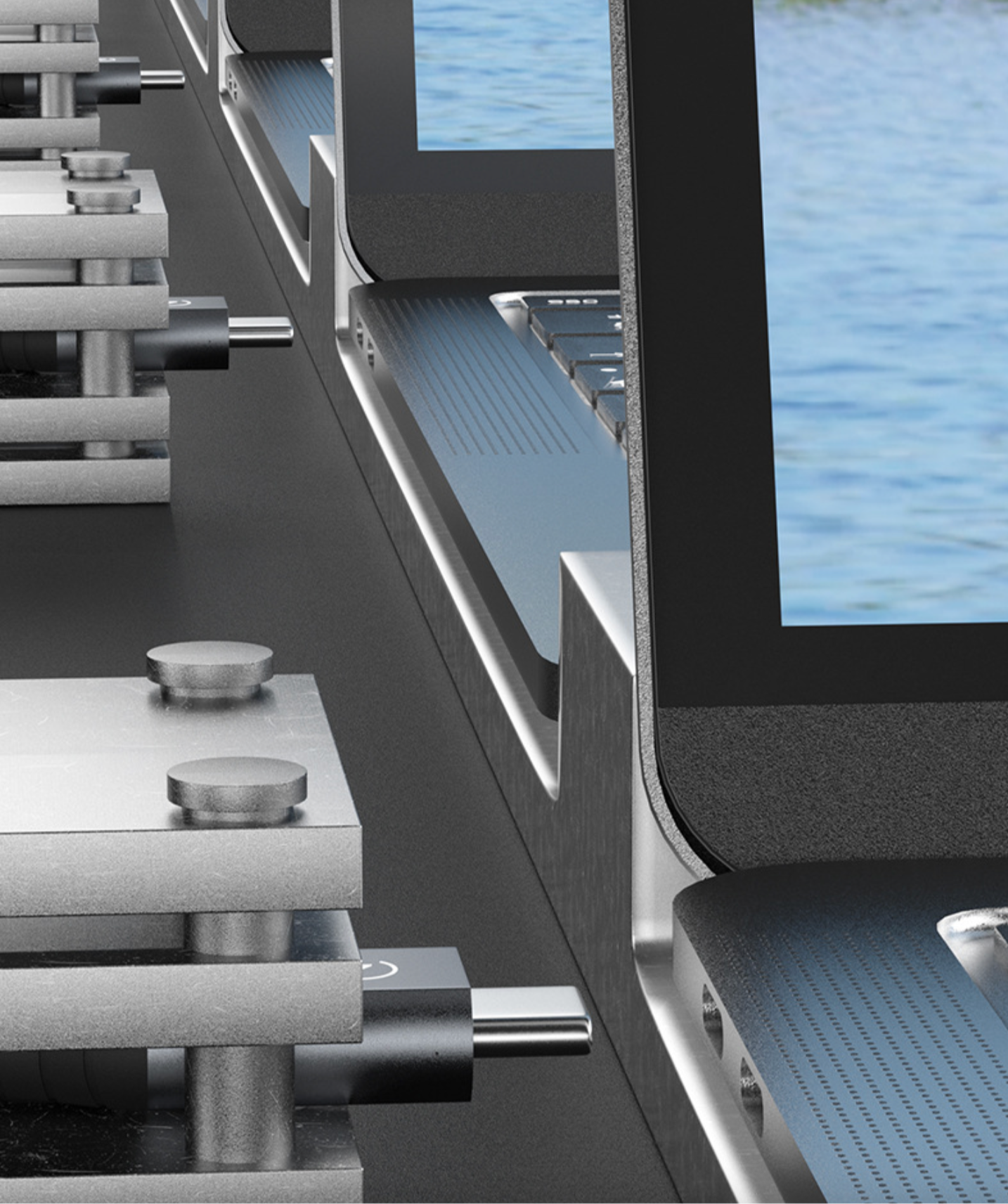 Close-up of a modern office chair with blue seat and black frame, featuring a water view in the background.