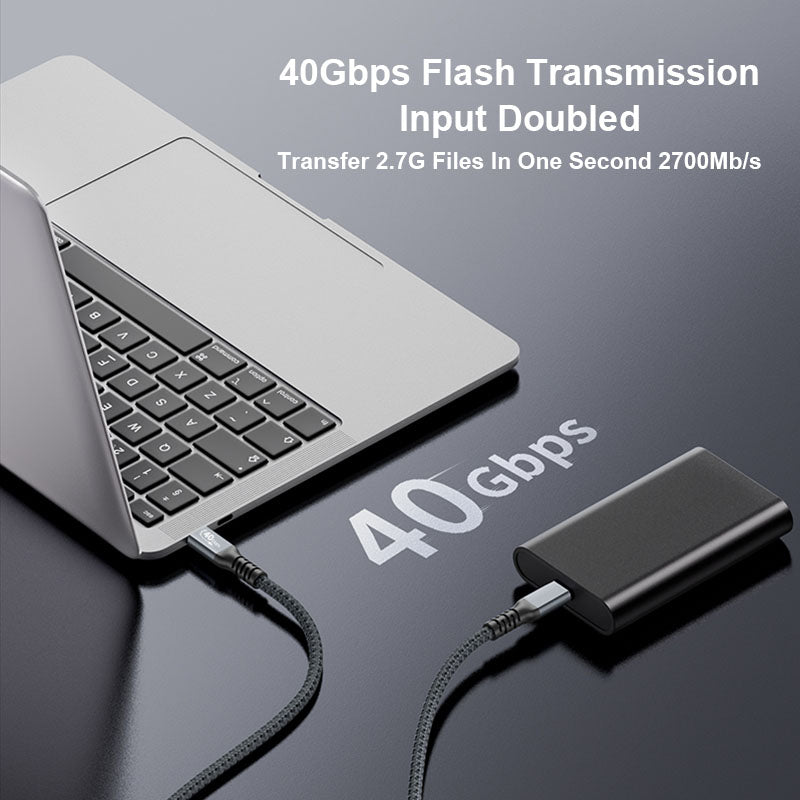 Laptop connected to a 40Gbps flash transmission device with text on a dark background