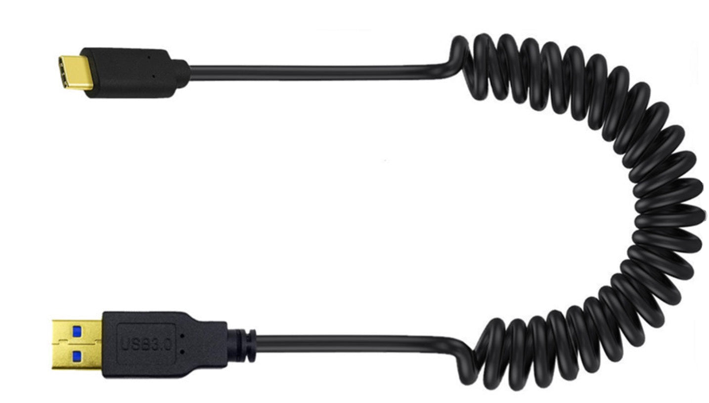 USB C coiled cable used for charging and data connectivity between devices
