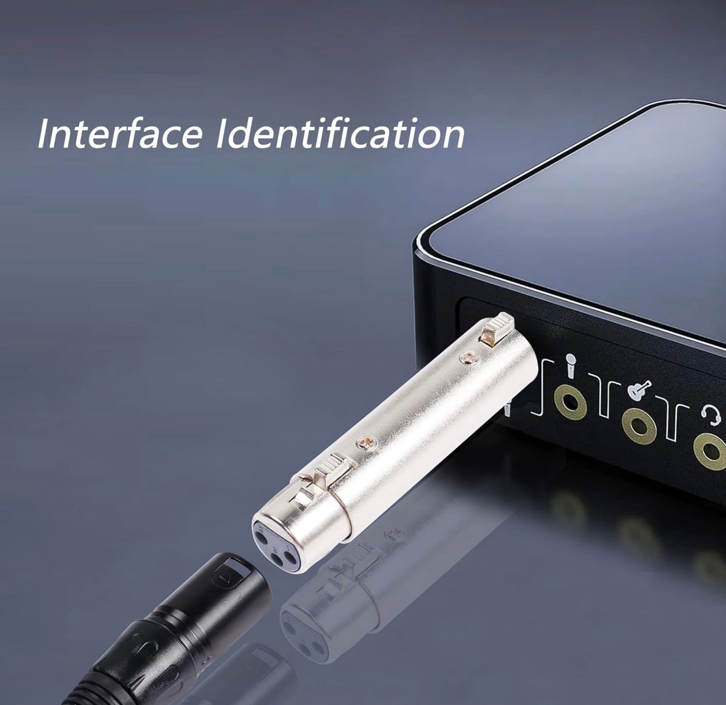 Close-up of a USB connector and laptop on a reflective surface.