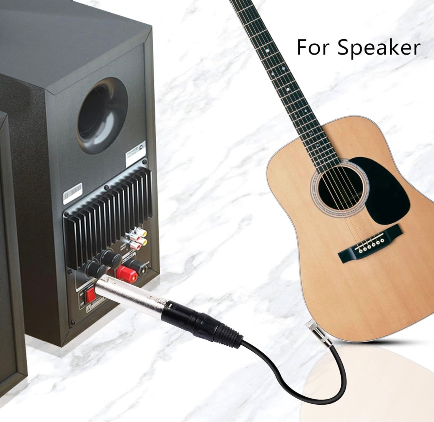 Guitar connected to a speaker with a cable.