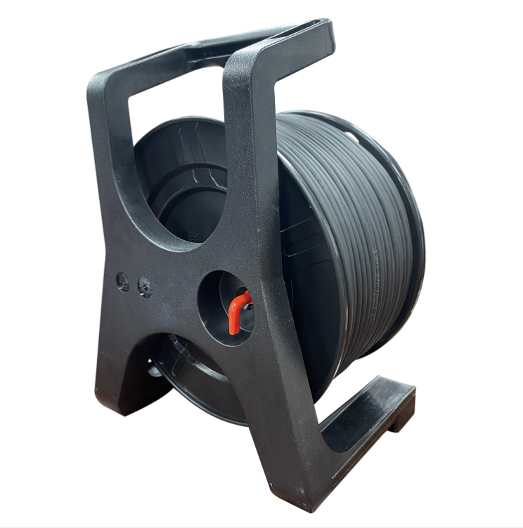 Black wire reel with spool on a white background