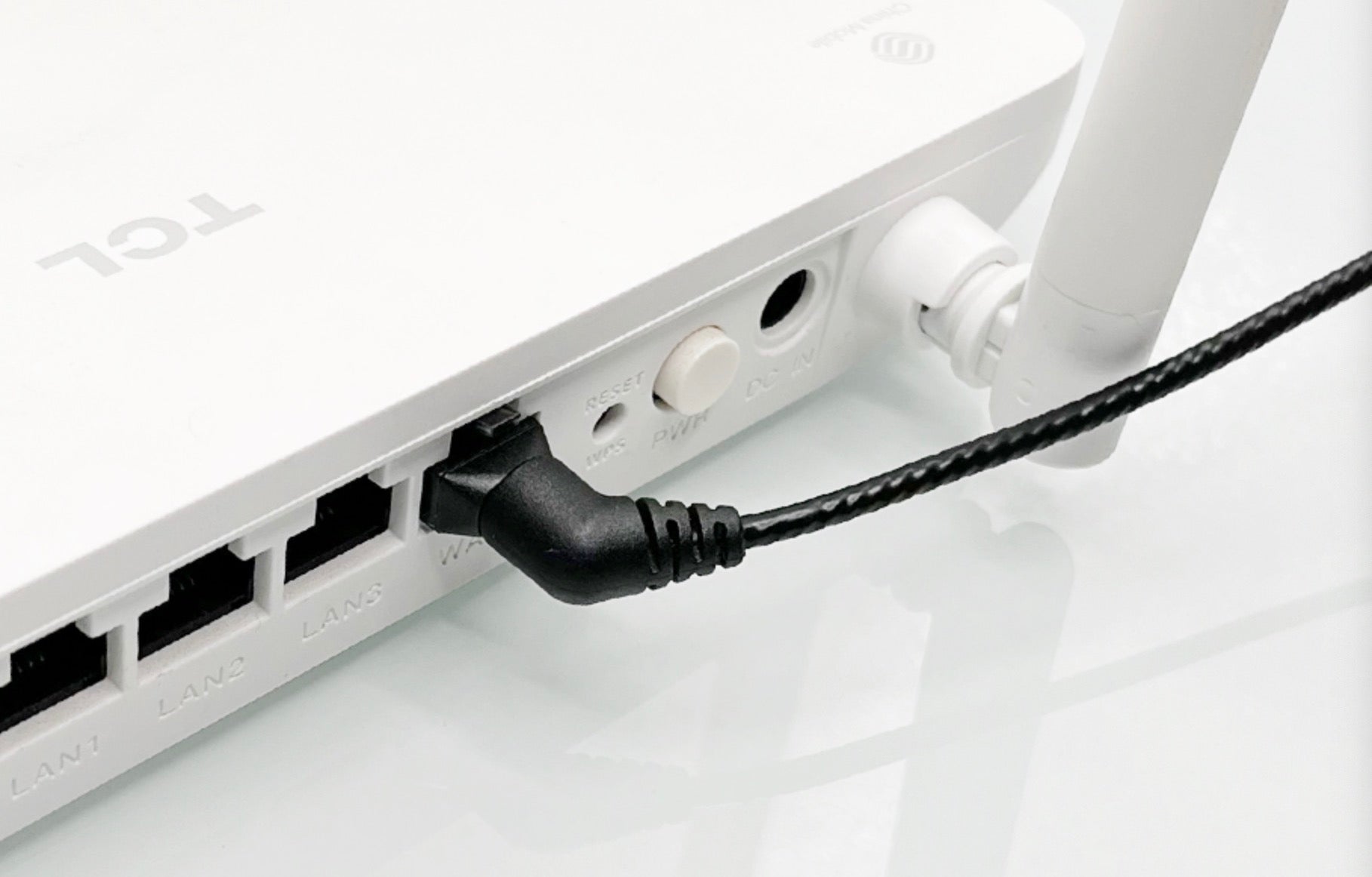 Cat6 slim Ethernet cable connected to a NAS storage device