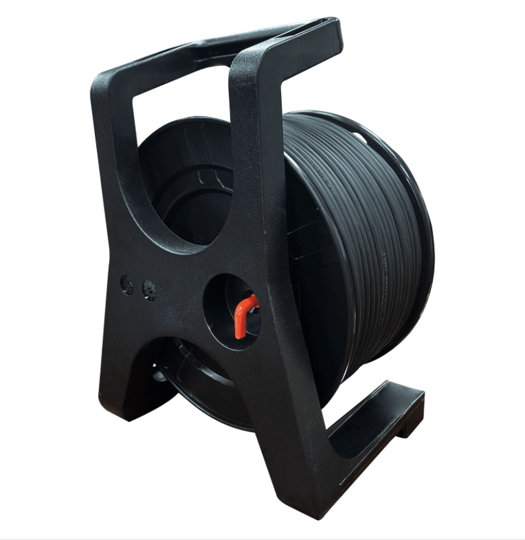 Black wire reel with spool of cable on a white background