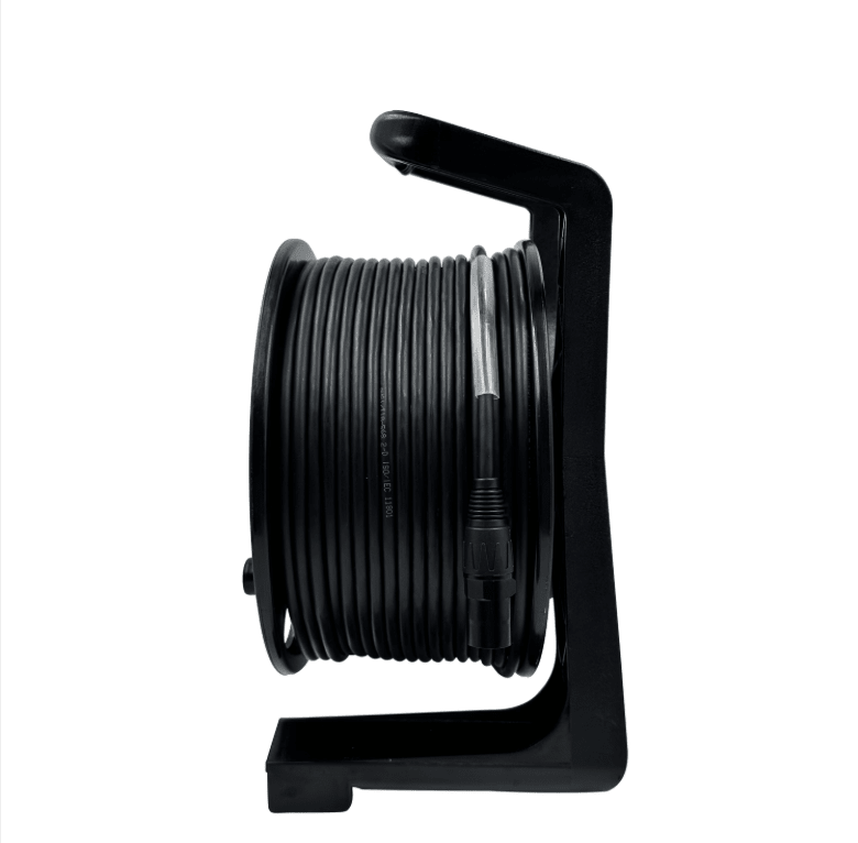 Black cable reel with coiled cable on a white background