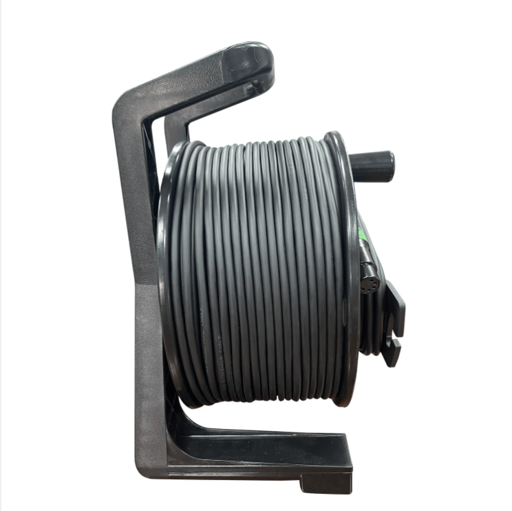 Black hose reel with coiled hose on a white background
