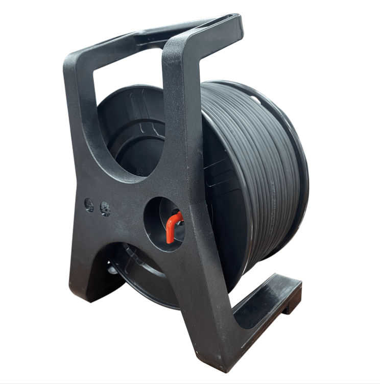 Black wire reel with spool on a white background