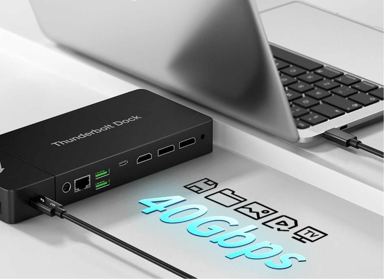 Thunderbolt dock with laptop on a desk, displaying connectivity options.