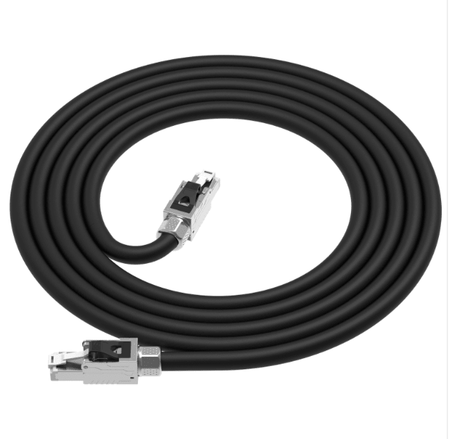Coiled black cable with metal connectors on a white background